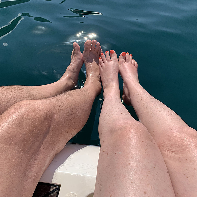 Legs on the yacht swim deck